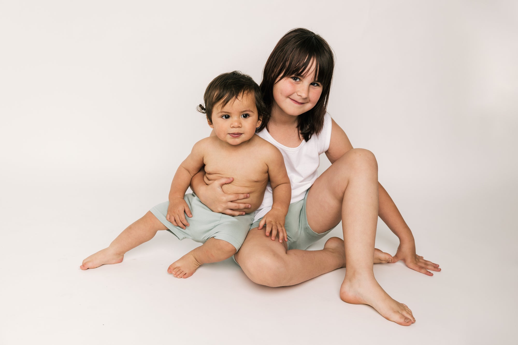 Child wearing Shorties – reusable shorts-style training pants for day or night