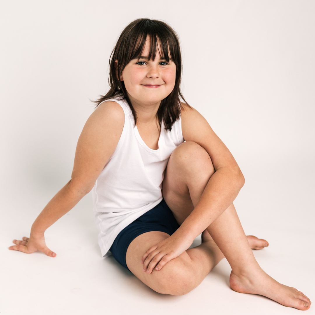 Child wearing Shorties – reusable shorts-style training pants for day or night
